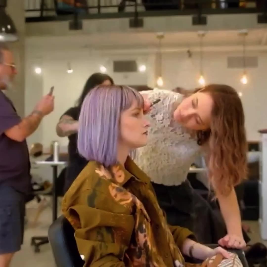 A Fuel education event on the Scotch Bonnet floor: a stylist working on a lilac bob while the class watches.
