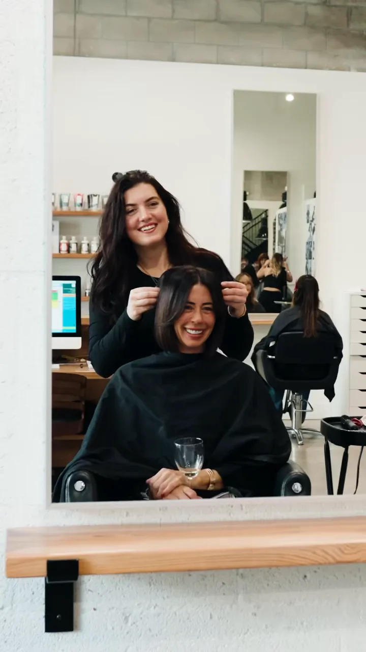 Kaylee giving a client the full service at Scotch Bonnet, product to round-brush finish.