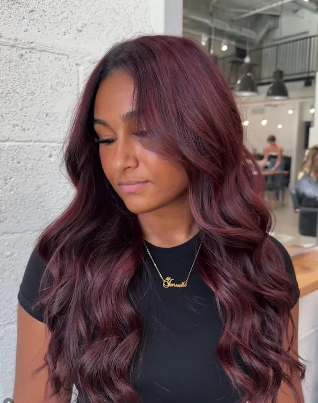 Deep black-cherry burgundy in glossy sculpted waves.