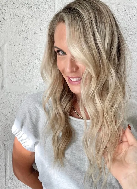 Cool blonde dimensional waves with a brightened money piece.
