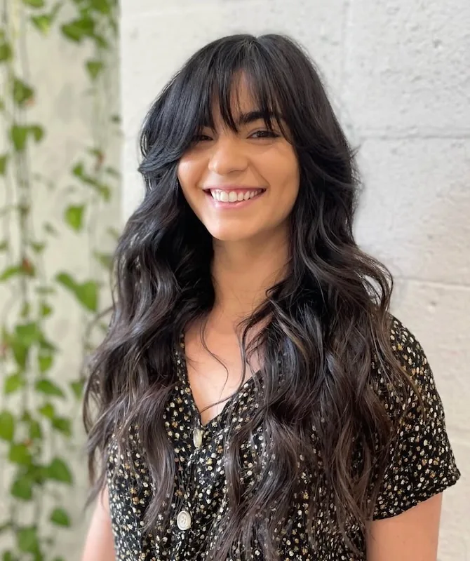 Long black shag with a curtain fringe and undone texture.