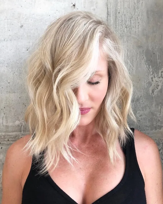 Icy blonde textured lob with a bright platinum face frame.