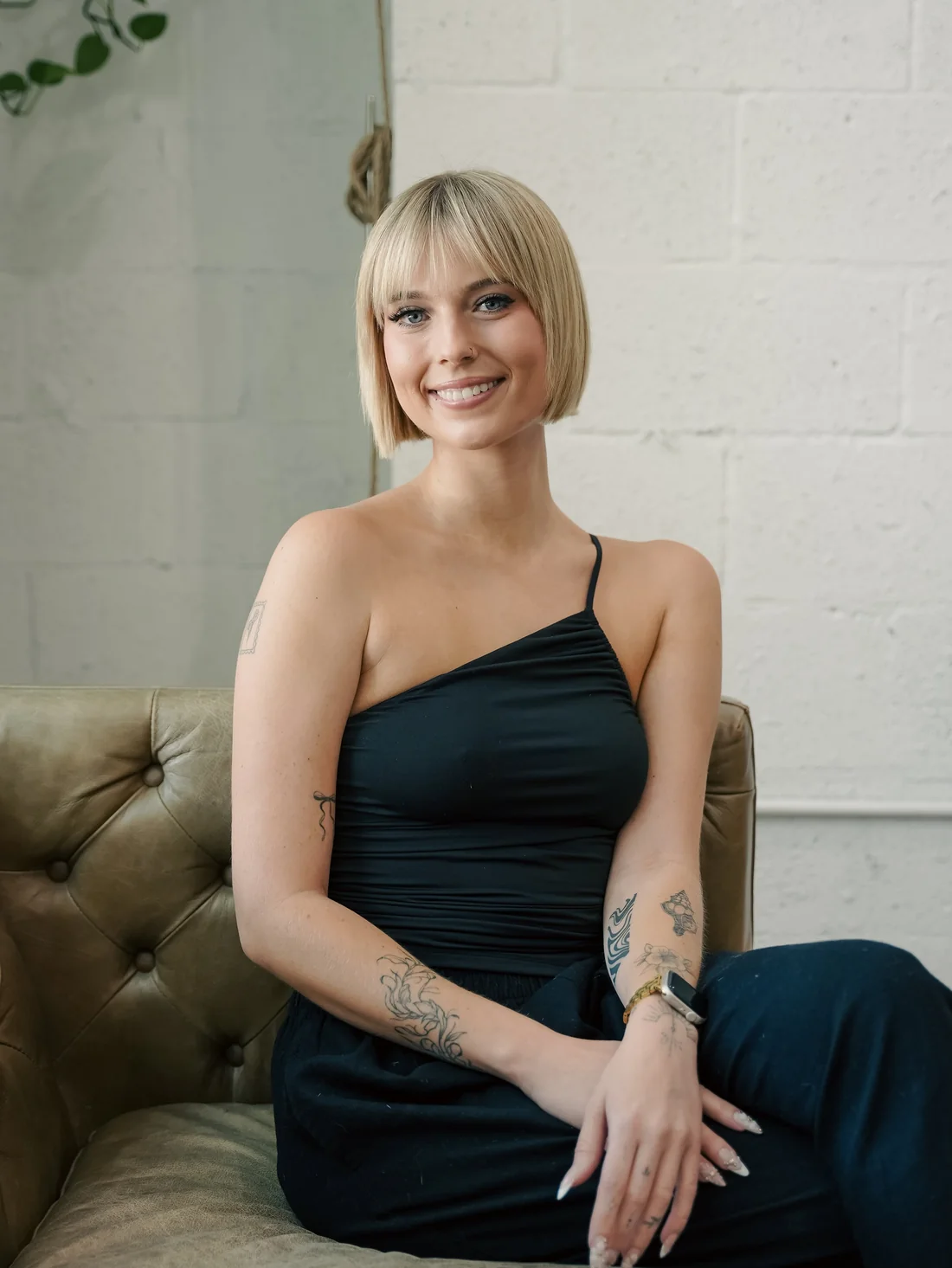 Paige Van Ryswyk, hair stylist at Scotch Bonnet, West Palm Beach Paige Van Ryswyk, hair stylist at Scotch Bonnet Hair Studio in downtown West Palm Beach, blunt blonde bob with bangs.